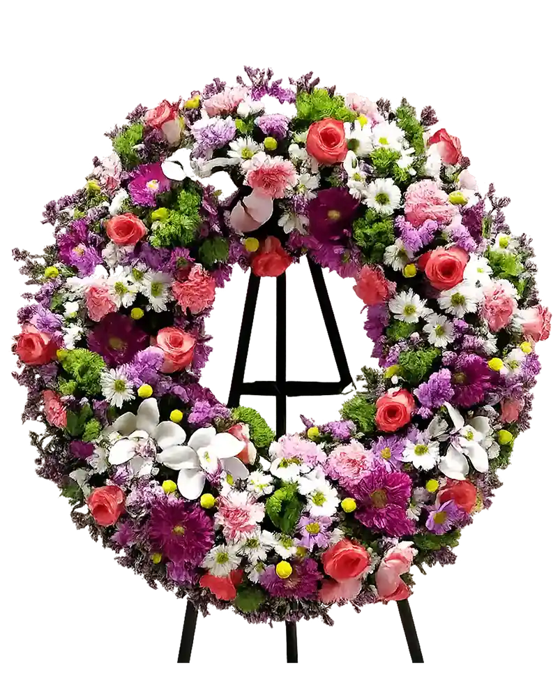 Corona floral colorida para funeral en Pamplona – rosas, orquídeas y crisantemos